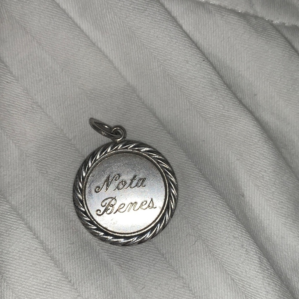 Vintage “Nota Benes” sterling silver (by Wells Sterling Co.) charm stamped